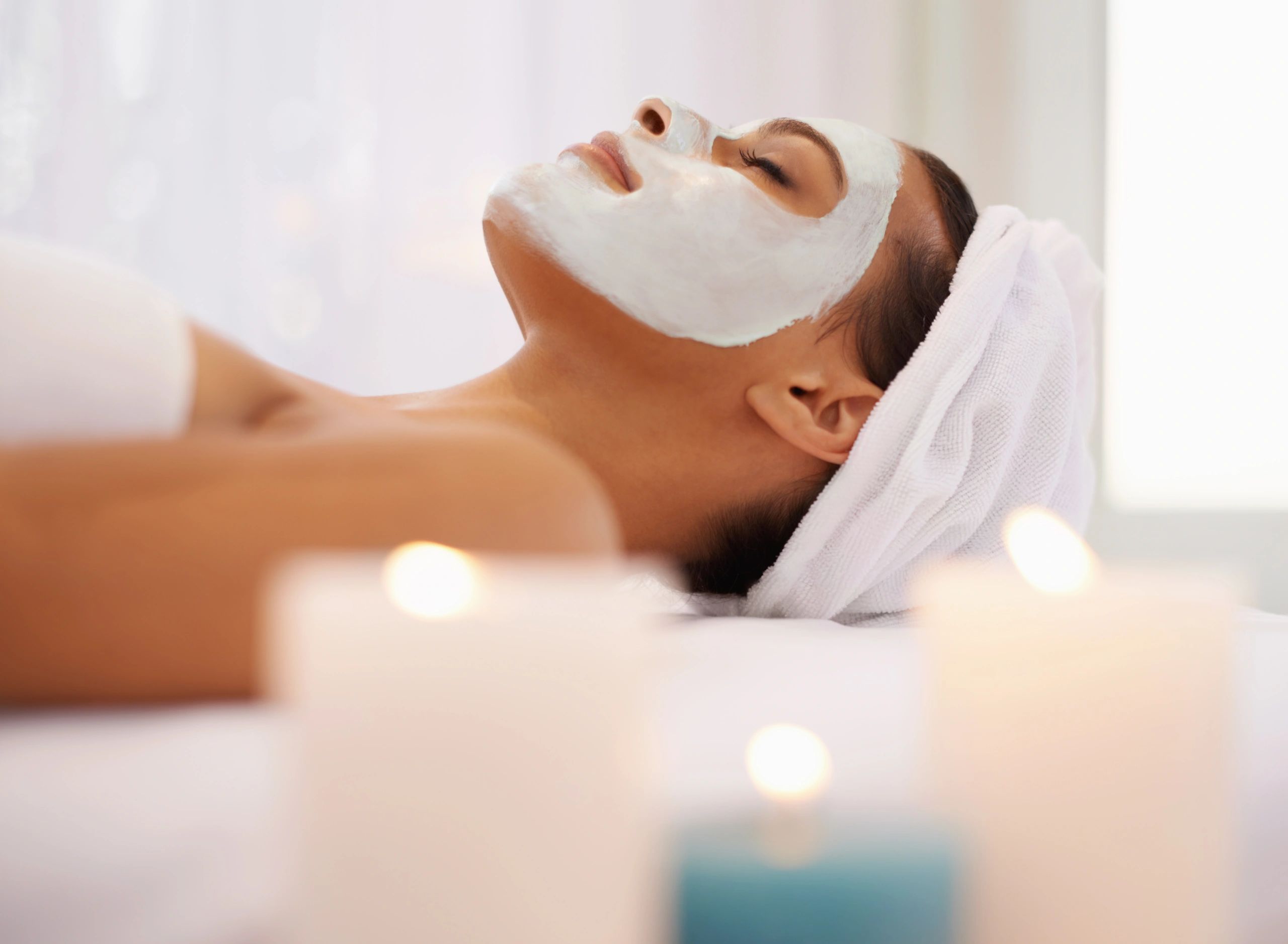 Client enjoying a relaxing facial treatment at a spa
